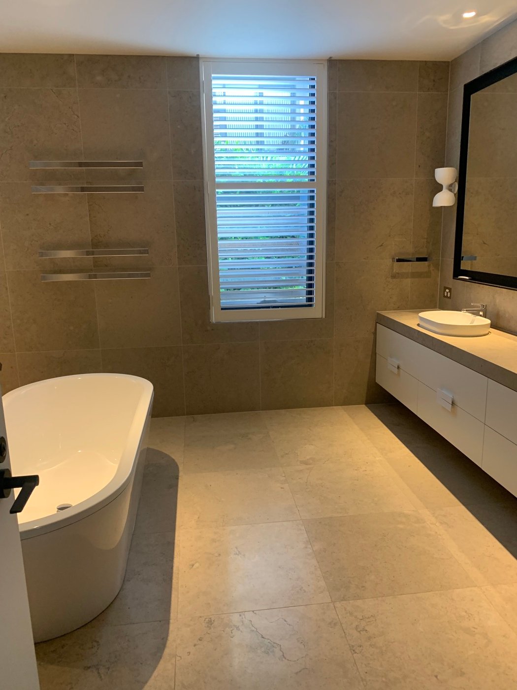 Bathroom floor and wall tiling in Brighton