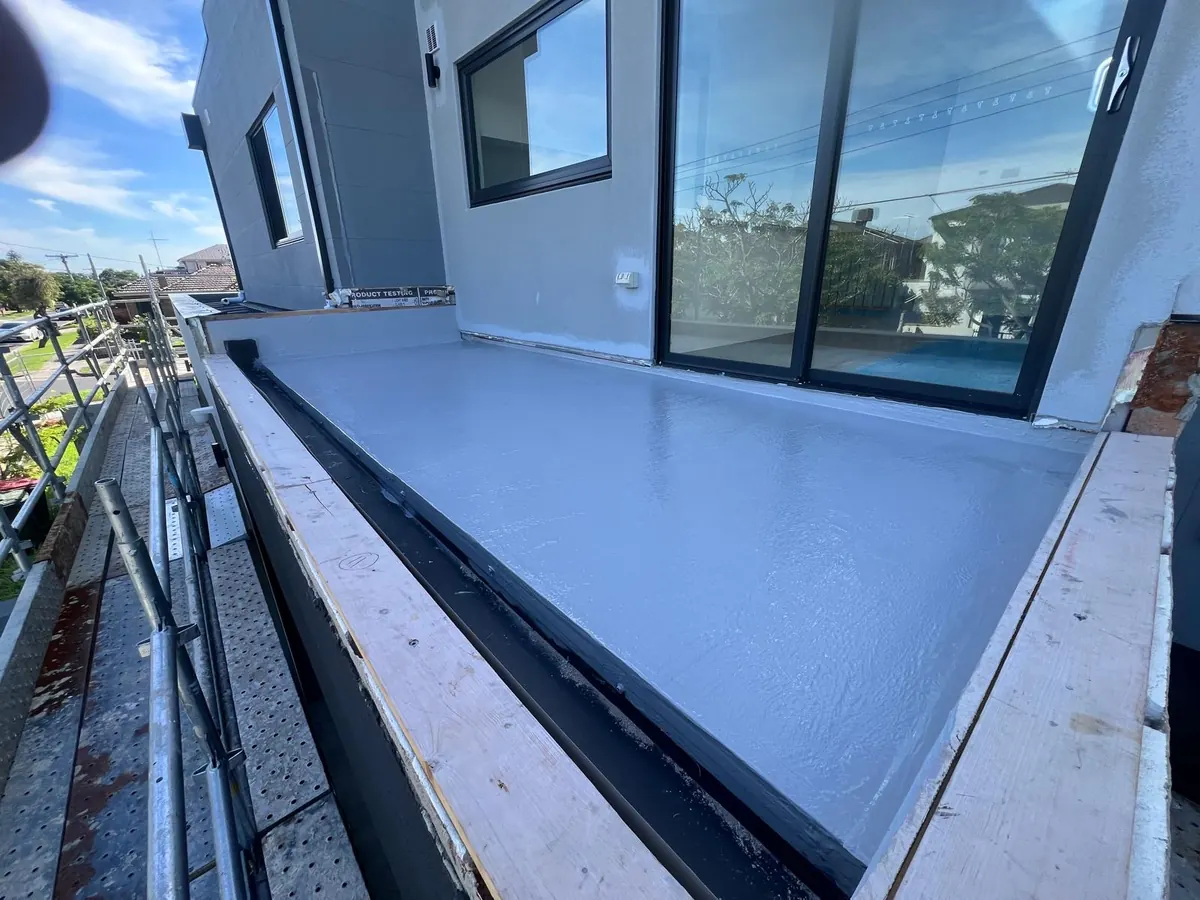 Balcony waterproofing membrane completed around external balcony doors
