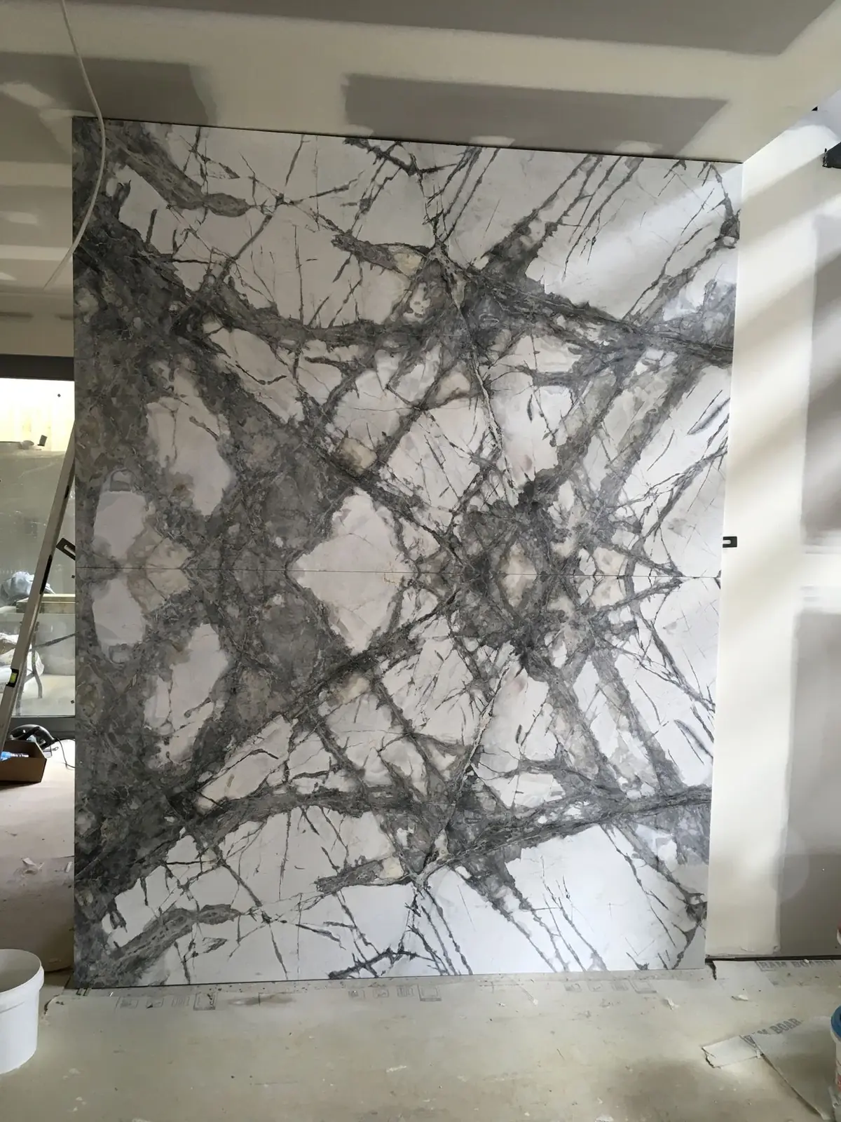 Premium large format porcelain slab feature wall installation by TN Stone Melbourne
