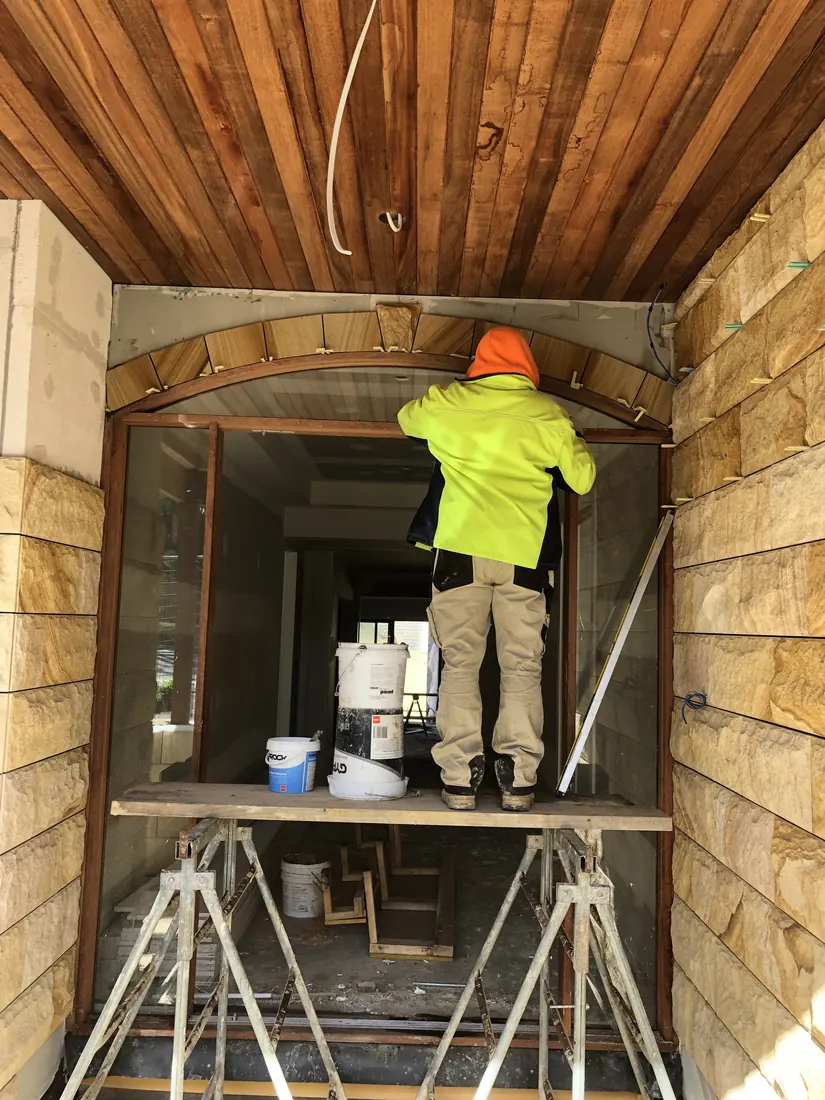 Pitch-faced sandstone cladding installed to residential front facade