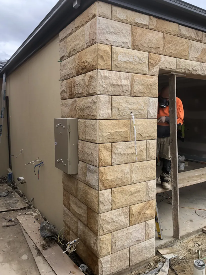 Residential sandstone cladding craftsmanship for Blackburn home