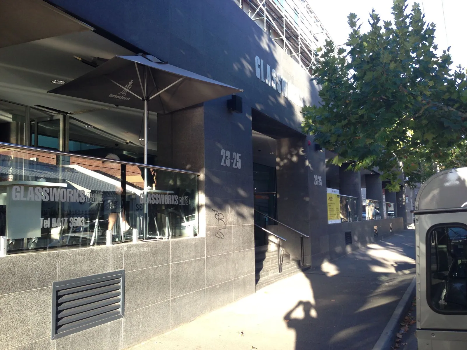 Mechanically fixed granite panels to the corner facade of a commercial building on Rokeby Street, Collingwood