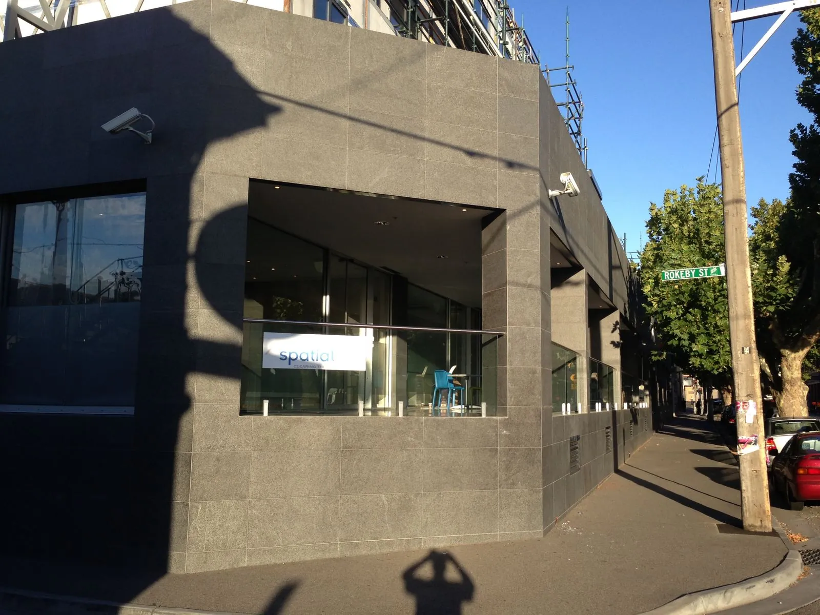 Flamed granite panel cladding installed around window openings on commercial building exterior