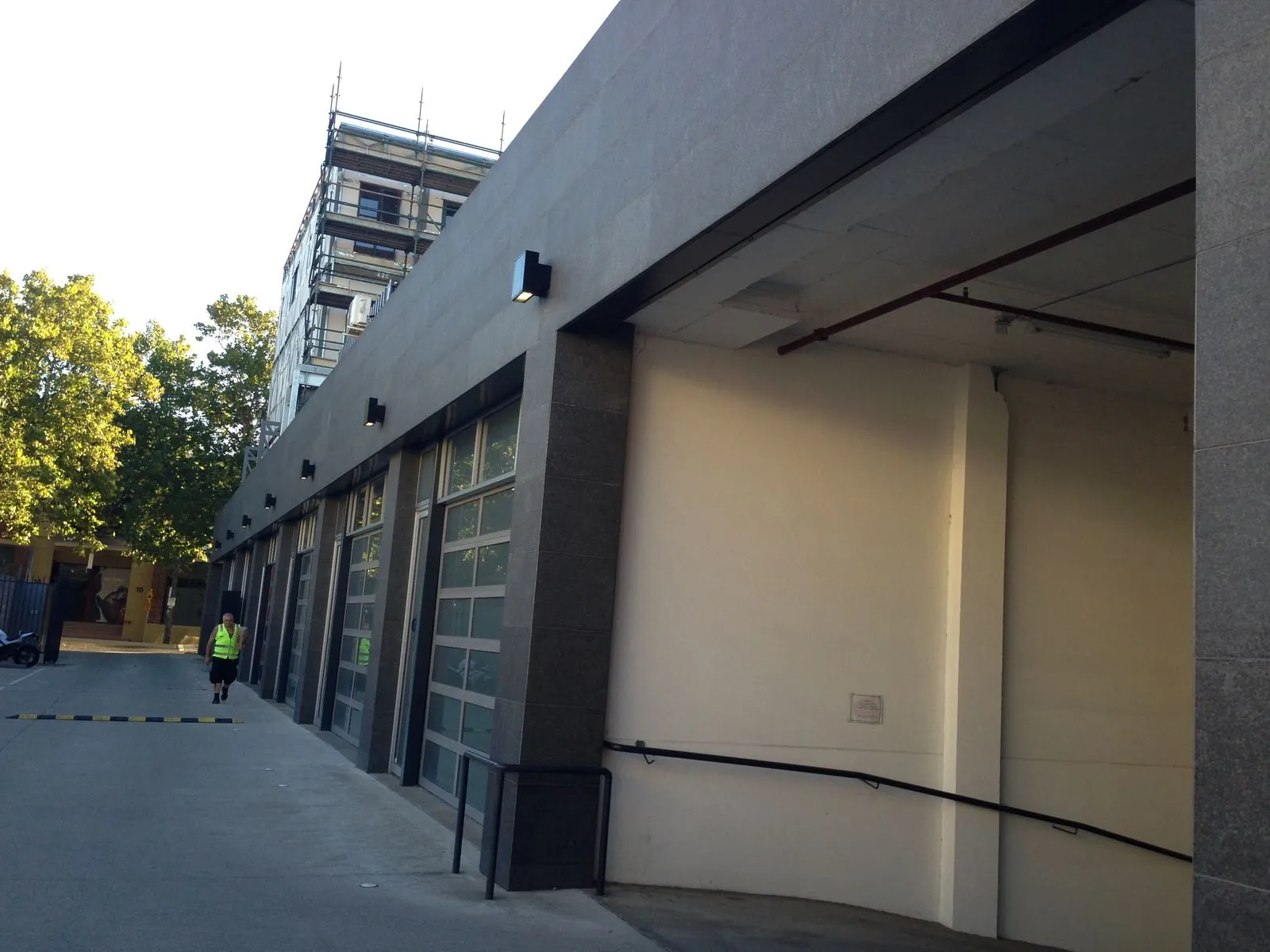 Granite panel cladding installed around loading dock and roller door openings