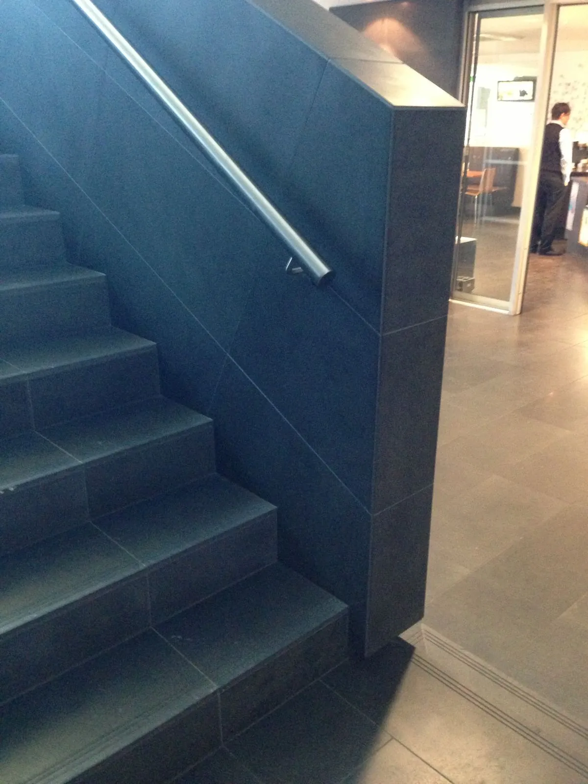 Bluestone stair treads and handrail detail installed inside the building