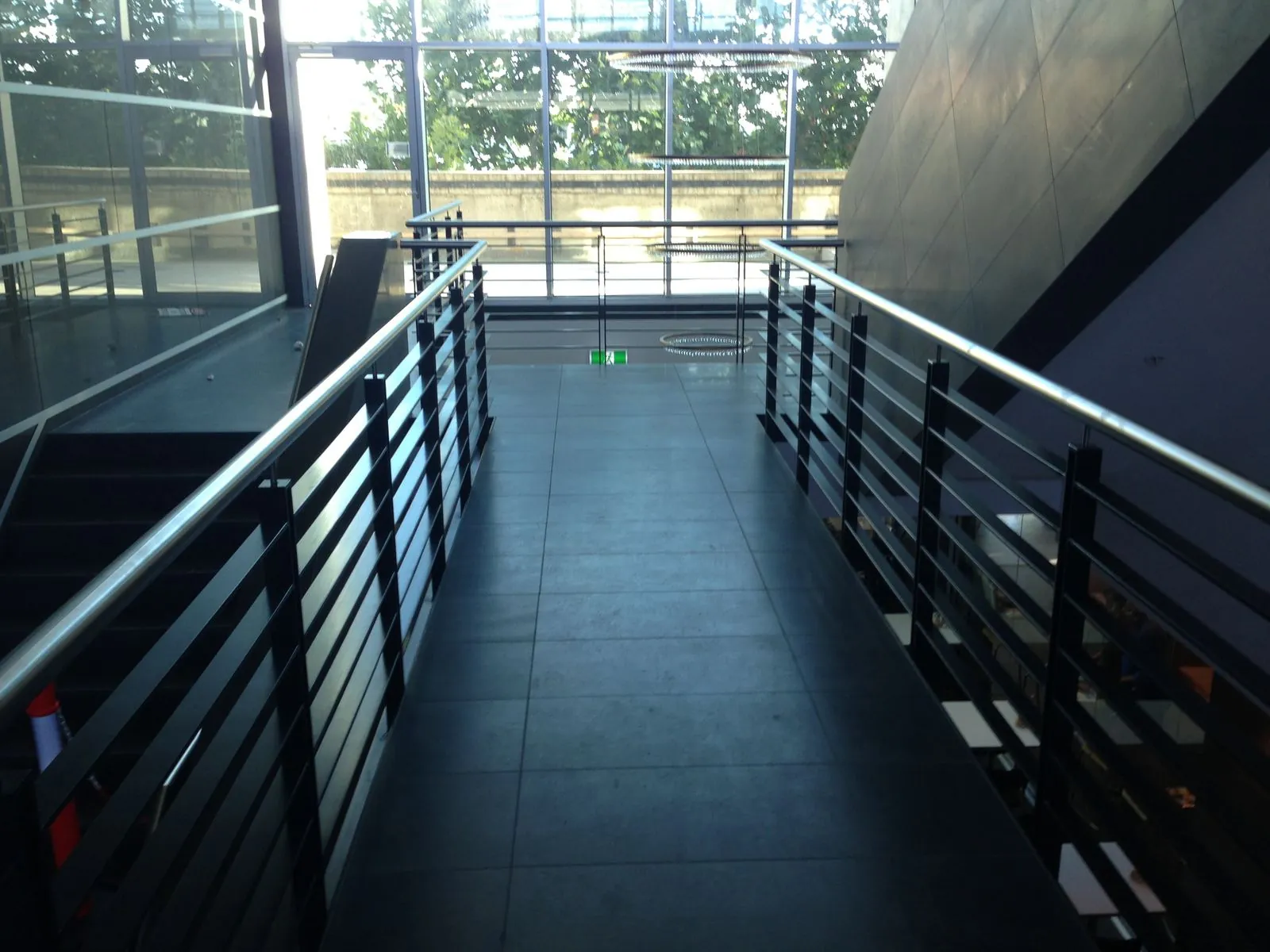 Bluestone flooring installed on an internal walkway and bridge with balustrade