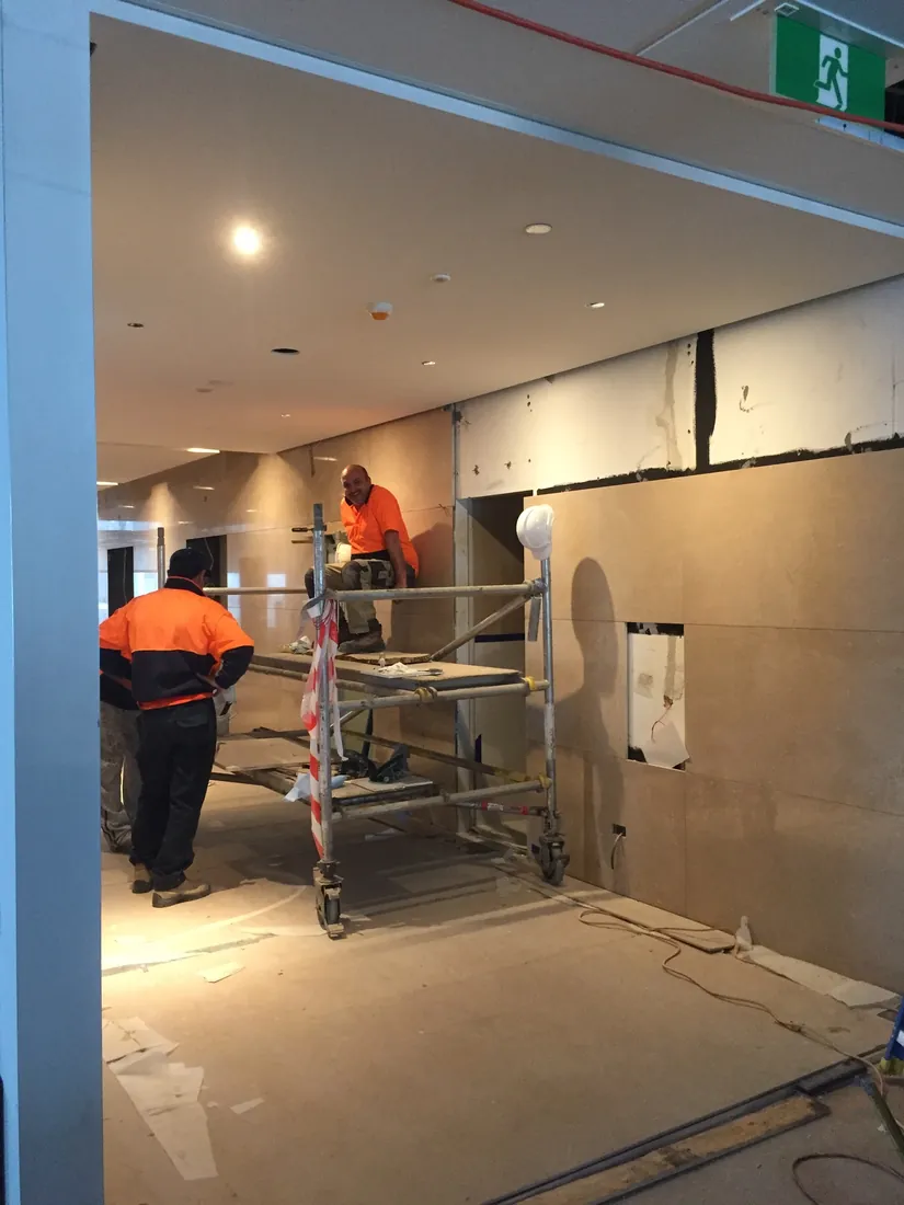 TN Stone installing Crema Marfil marble panels at Collins Place Melbourne