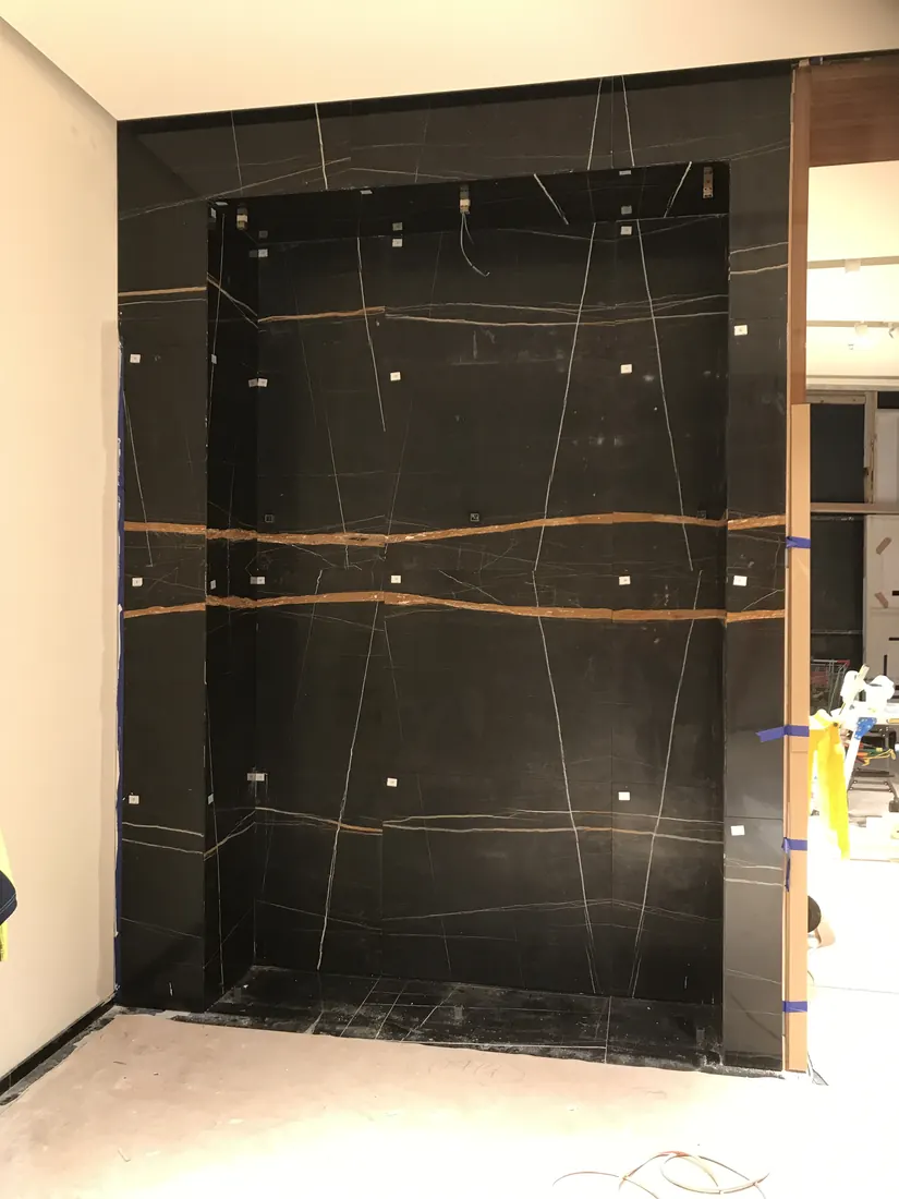 Mechanically fixed marble panel installation for luxury retail fit-out in Chadstone