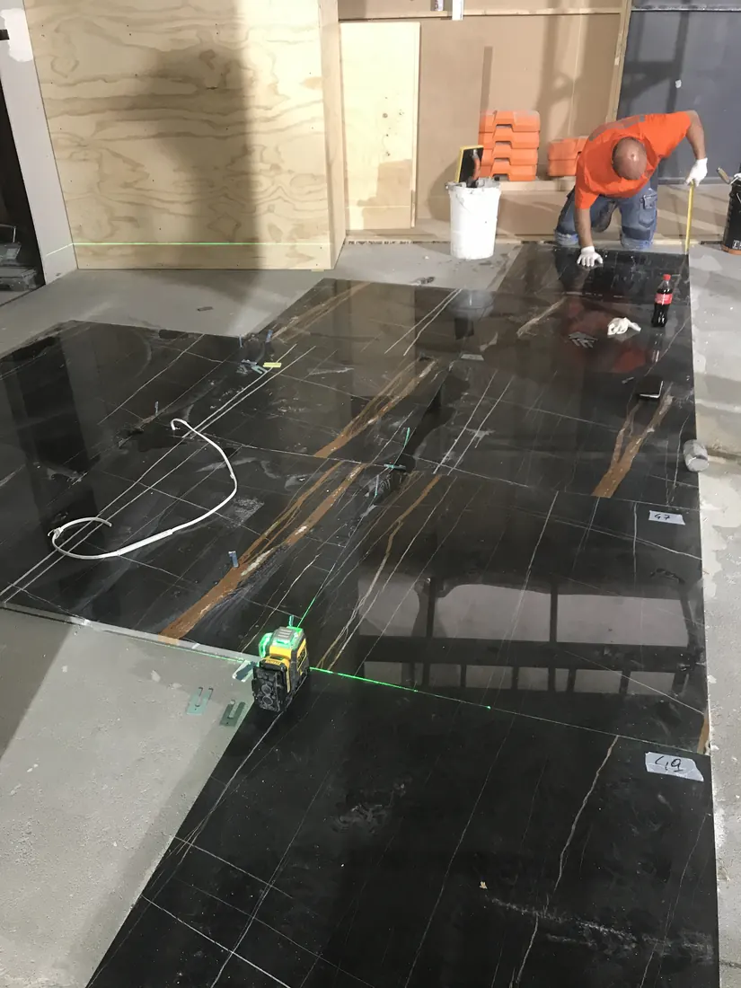 Marble floor panel installation and set-out for luxury retail interior