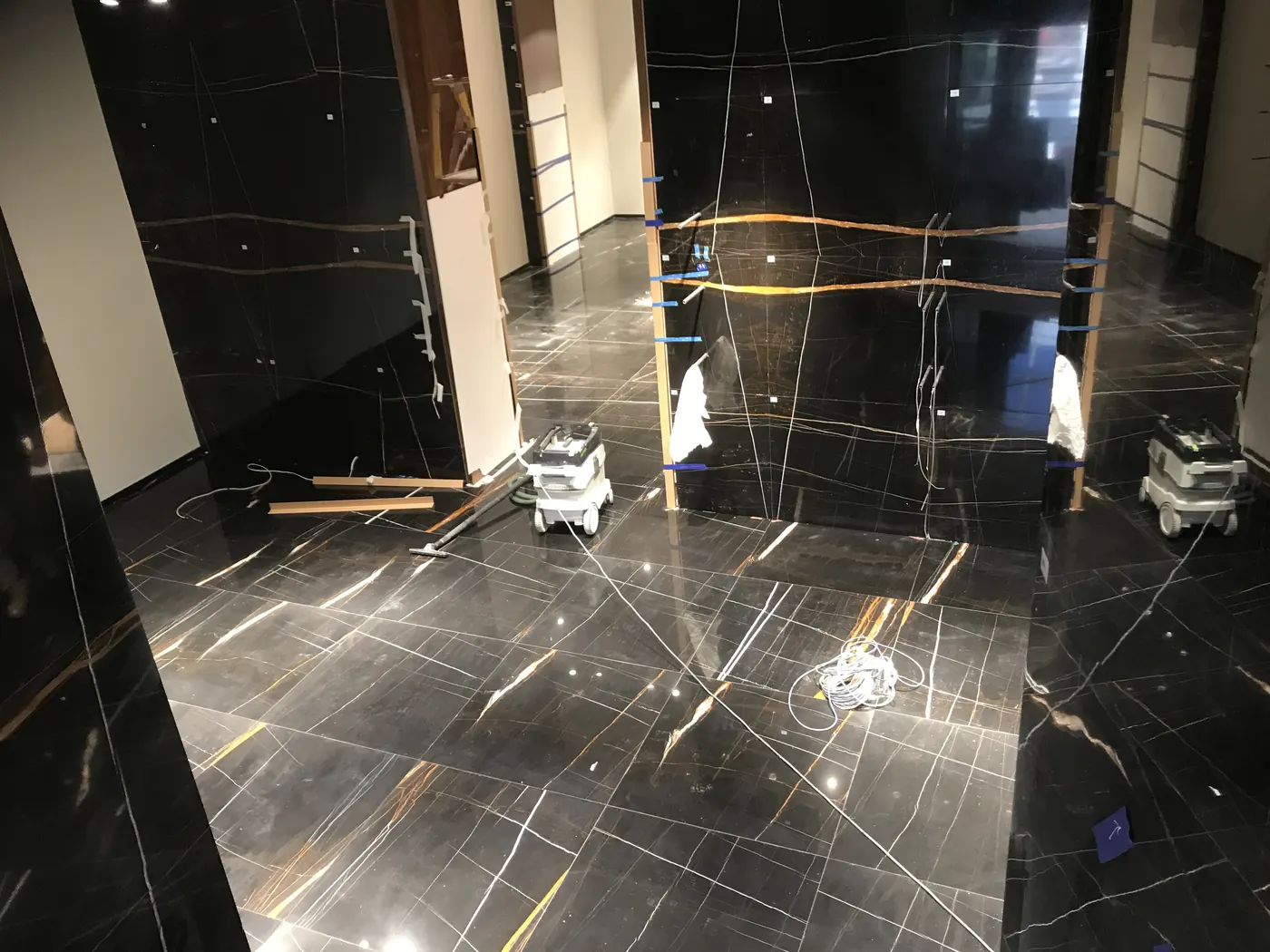 Black marble walls and flooring installed for premium retail interior