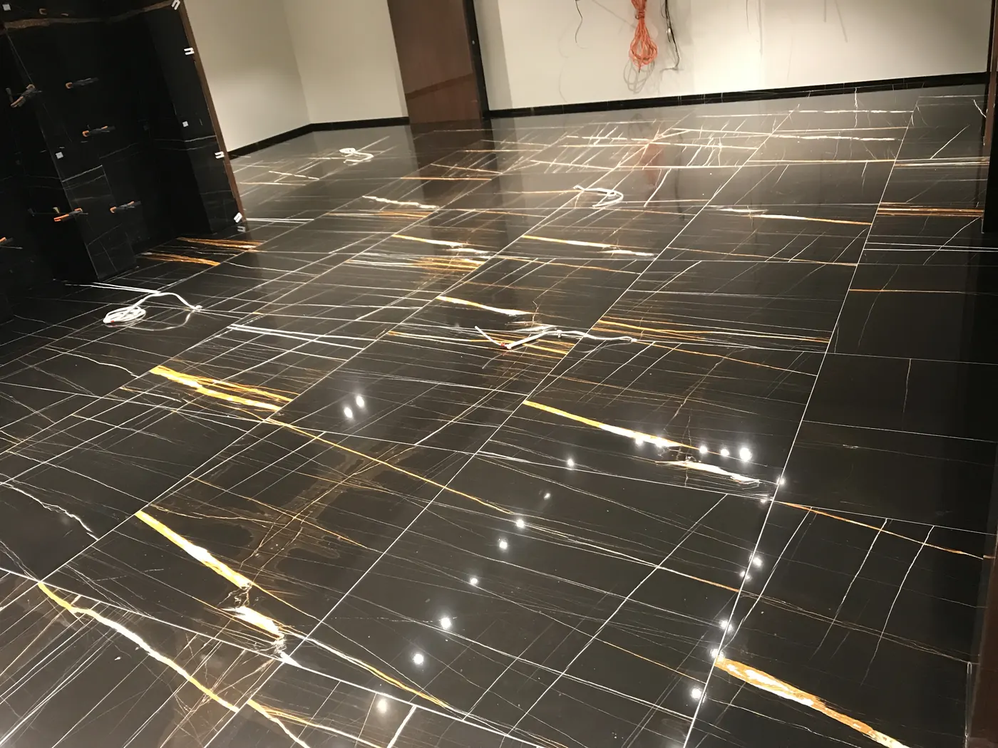 Polished black marble floor finish for luxury retail project
