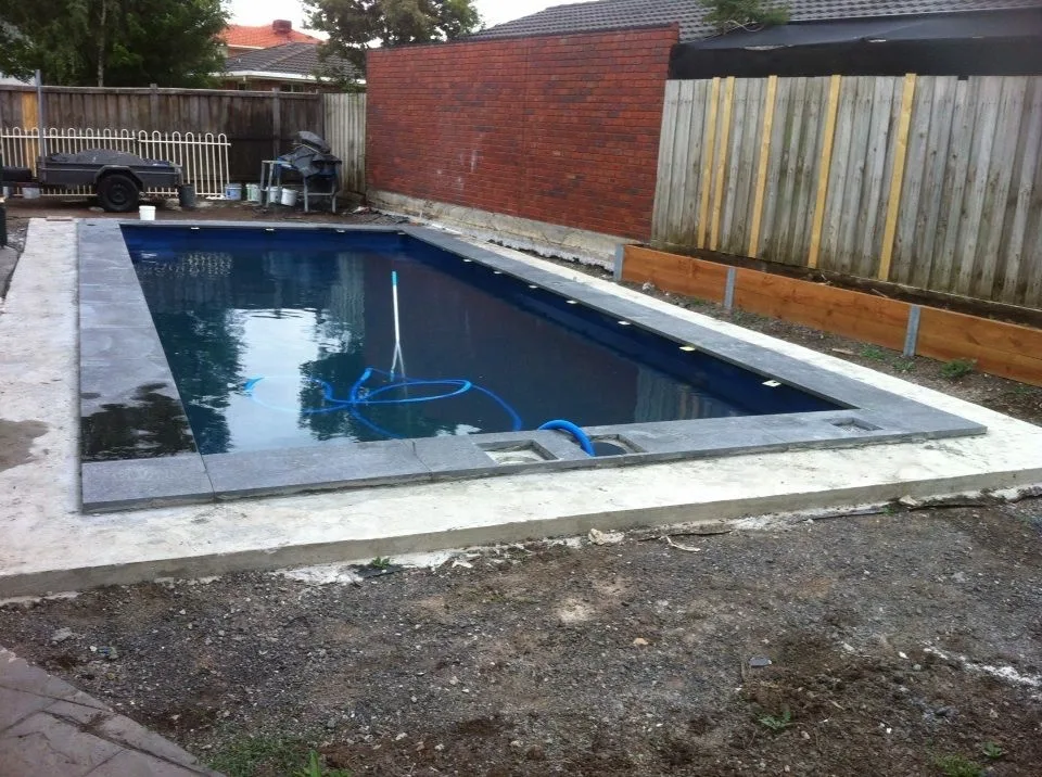 Granite pool coping viewed from the outdoor entertaining area