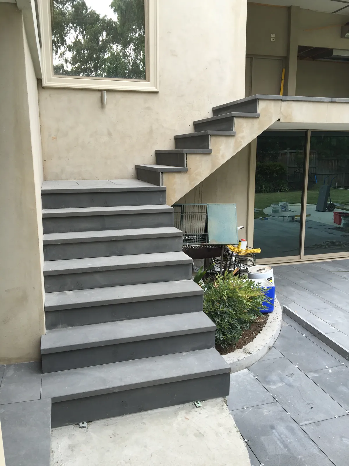 Bluestone stair treads installed on the rear exterior staircase leading to the upper balcony