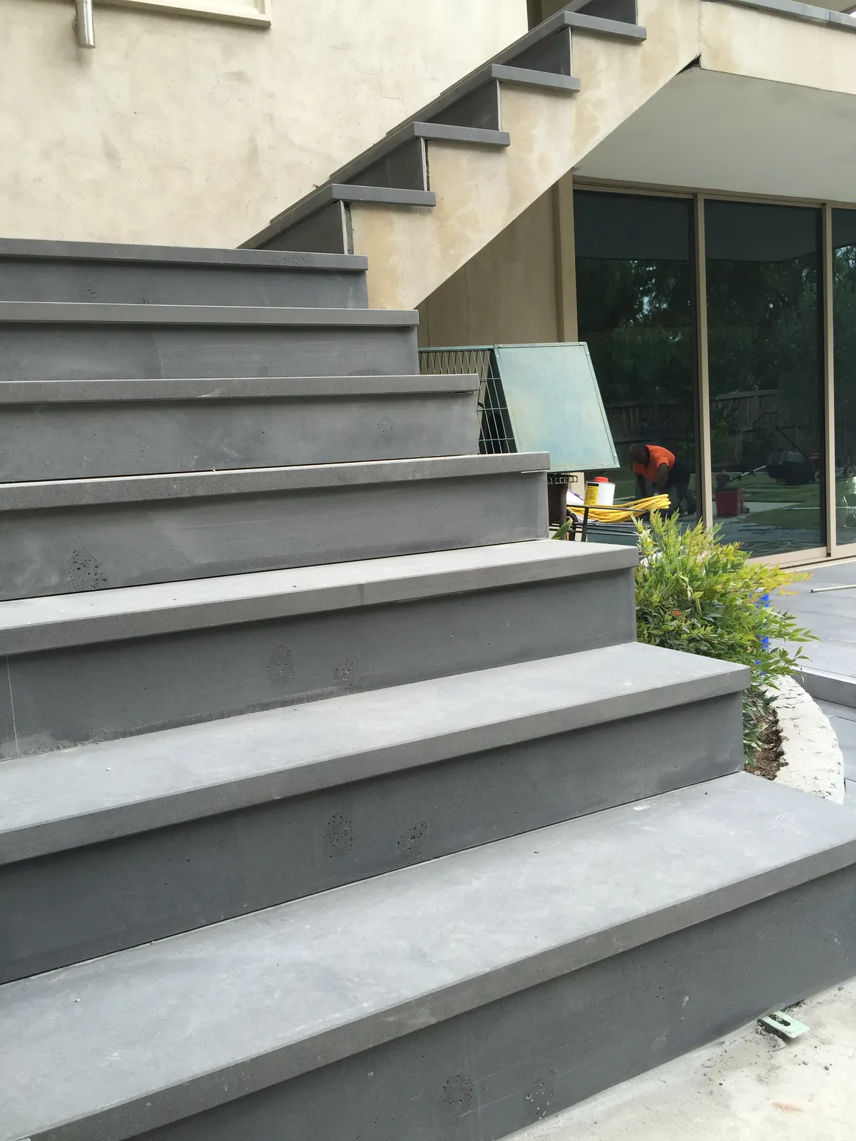 Close-up of bluestone stair tread installation on the exterior staircase