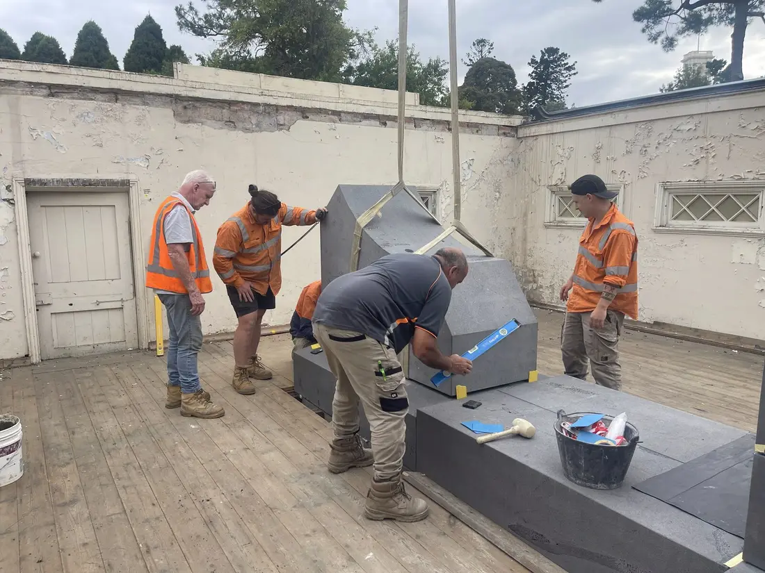 TN Stone and O'Connors and Sons positioning and levelling a heritage bluestone pier block