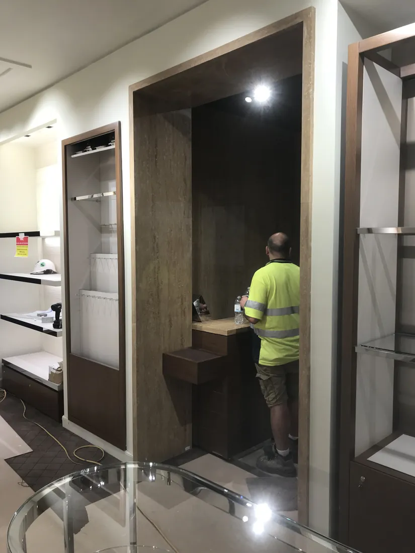 Natural limestone wall panel detailing for premium retail interior