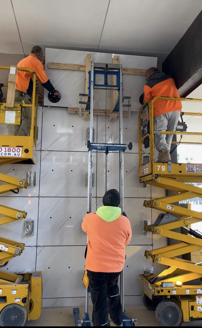 TN Stone working on mechanically fixed marble wall panels for All Souls Mausoleum