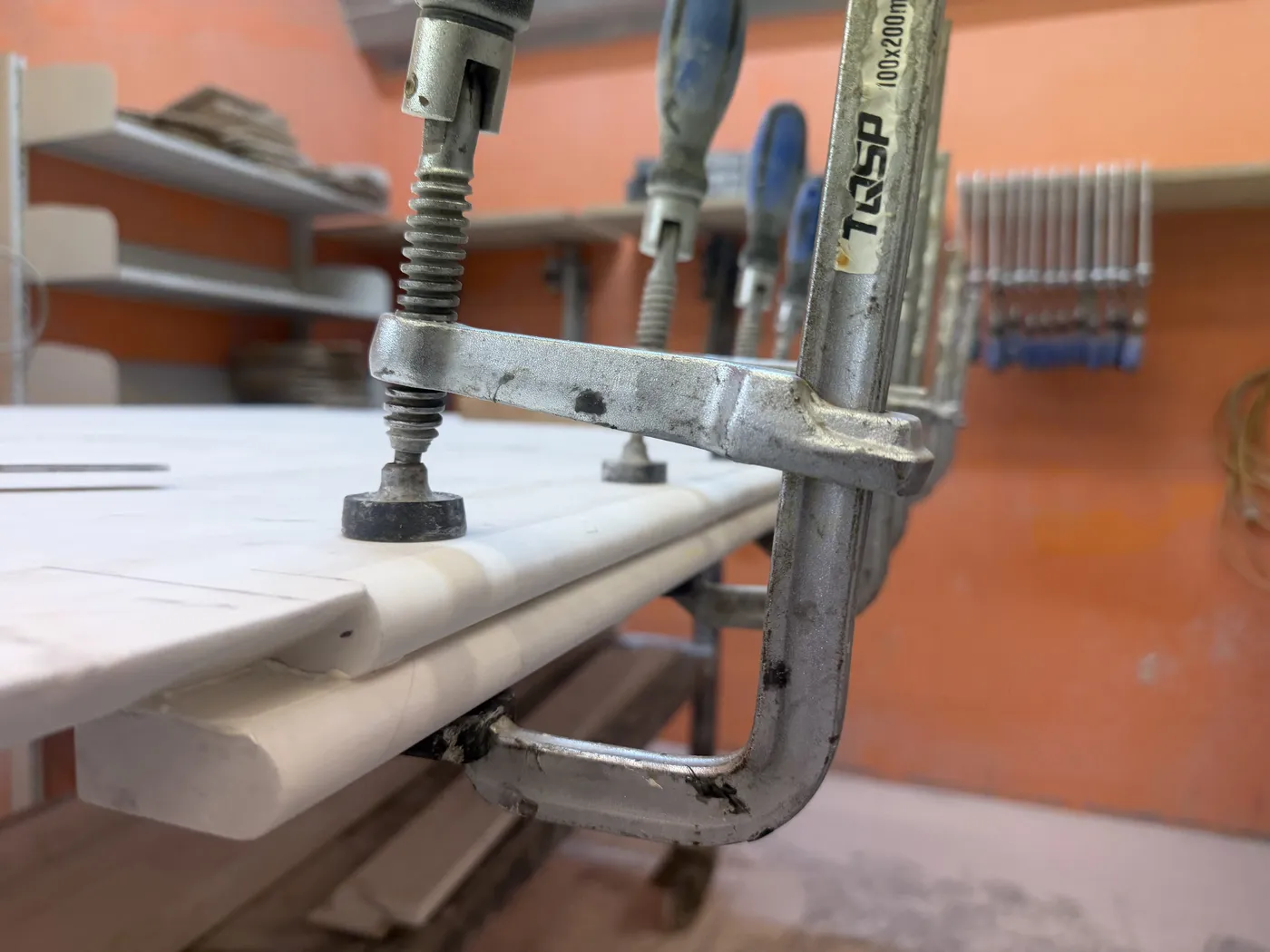 Double bullnose edge profile clamped during fabrication at TN Stone workshop