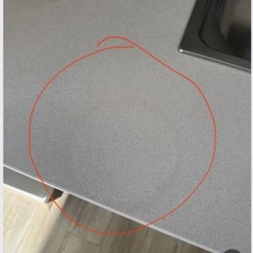 Stone benchtop with staining around the sink area before treatment by TN Stone