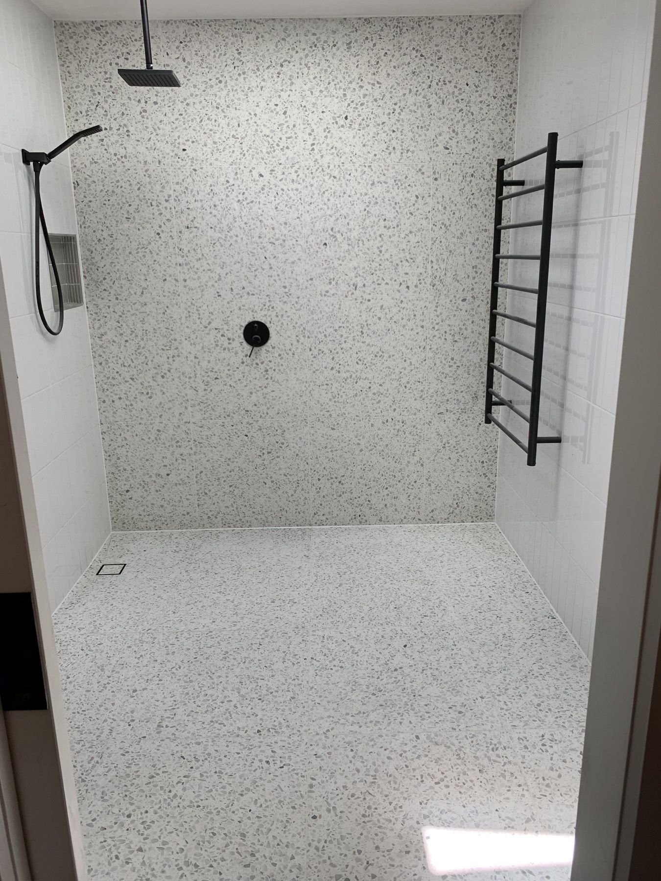 Premium bathroom wall and floor tiling project in Melbourne by TN Stone