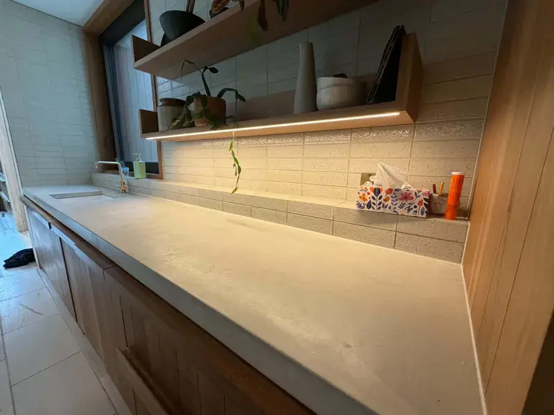 Finished caulked joint on a concrete benchtop and splashback in Toorak