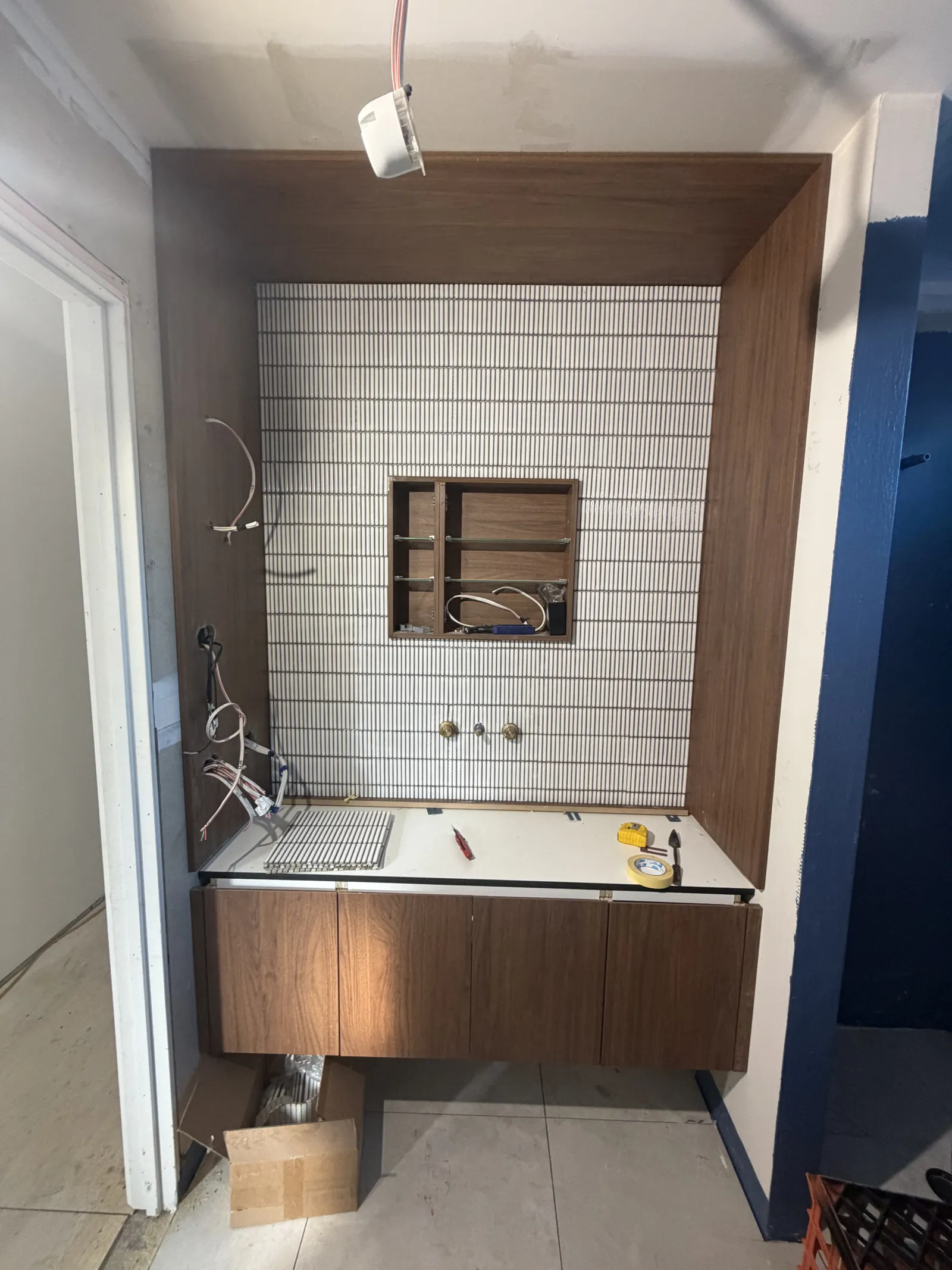 Finished pencil-tiled vanity with epoxy grout