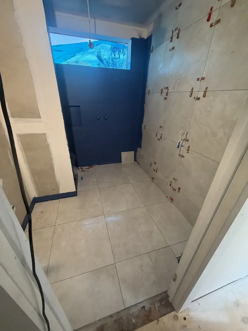 Completed large-format porcelain shower in Mitcham bathroom