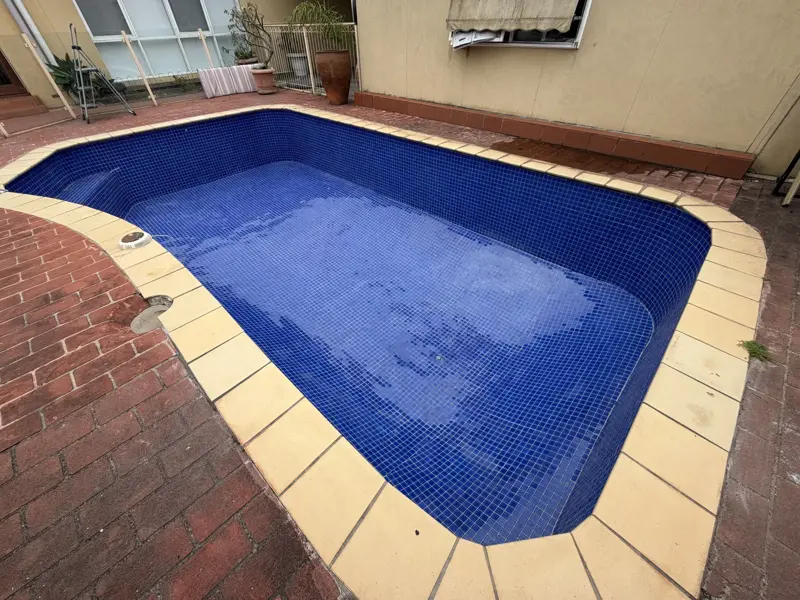 Finished Moorabbin swimming pool with dark blue glass mosaic tiles