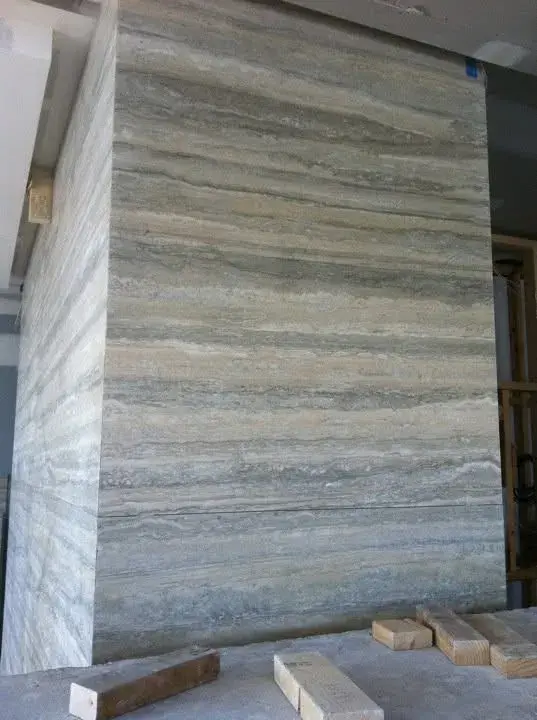 Book-matched travertine slab panel in South Yarra penthouse