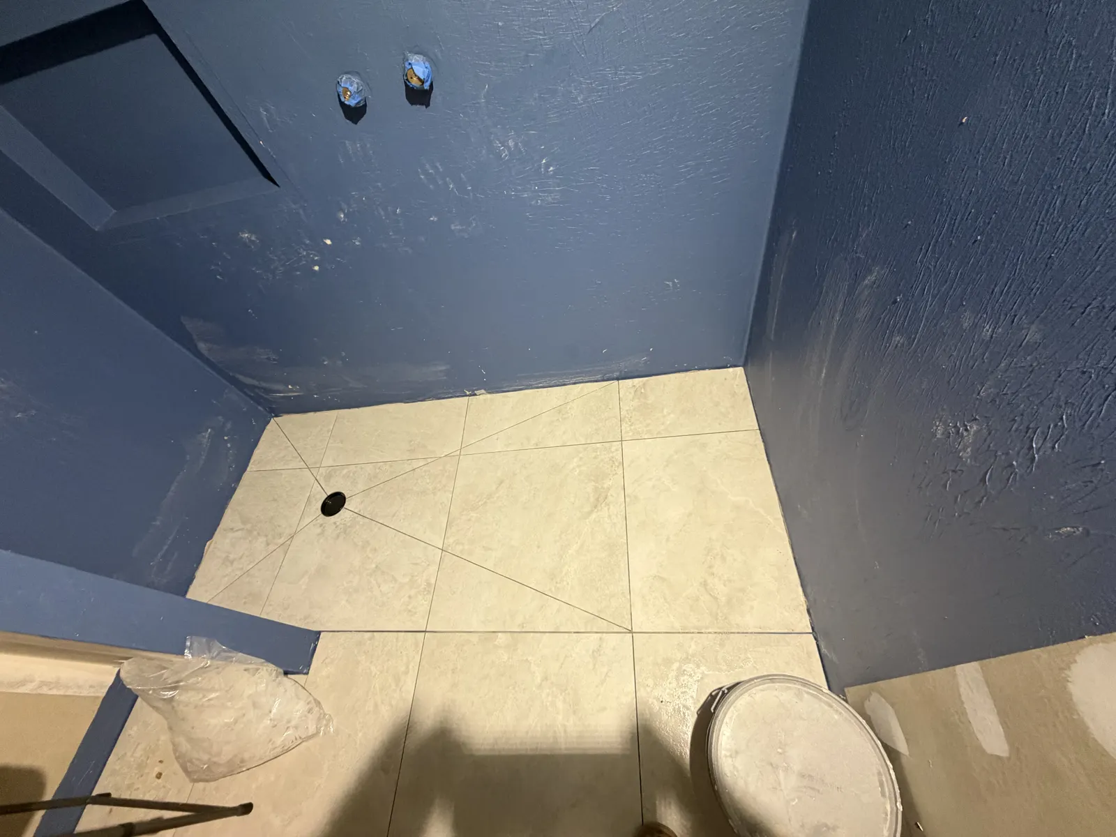 Finished porcelain floor tile detail with minimal grout lines