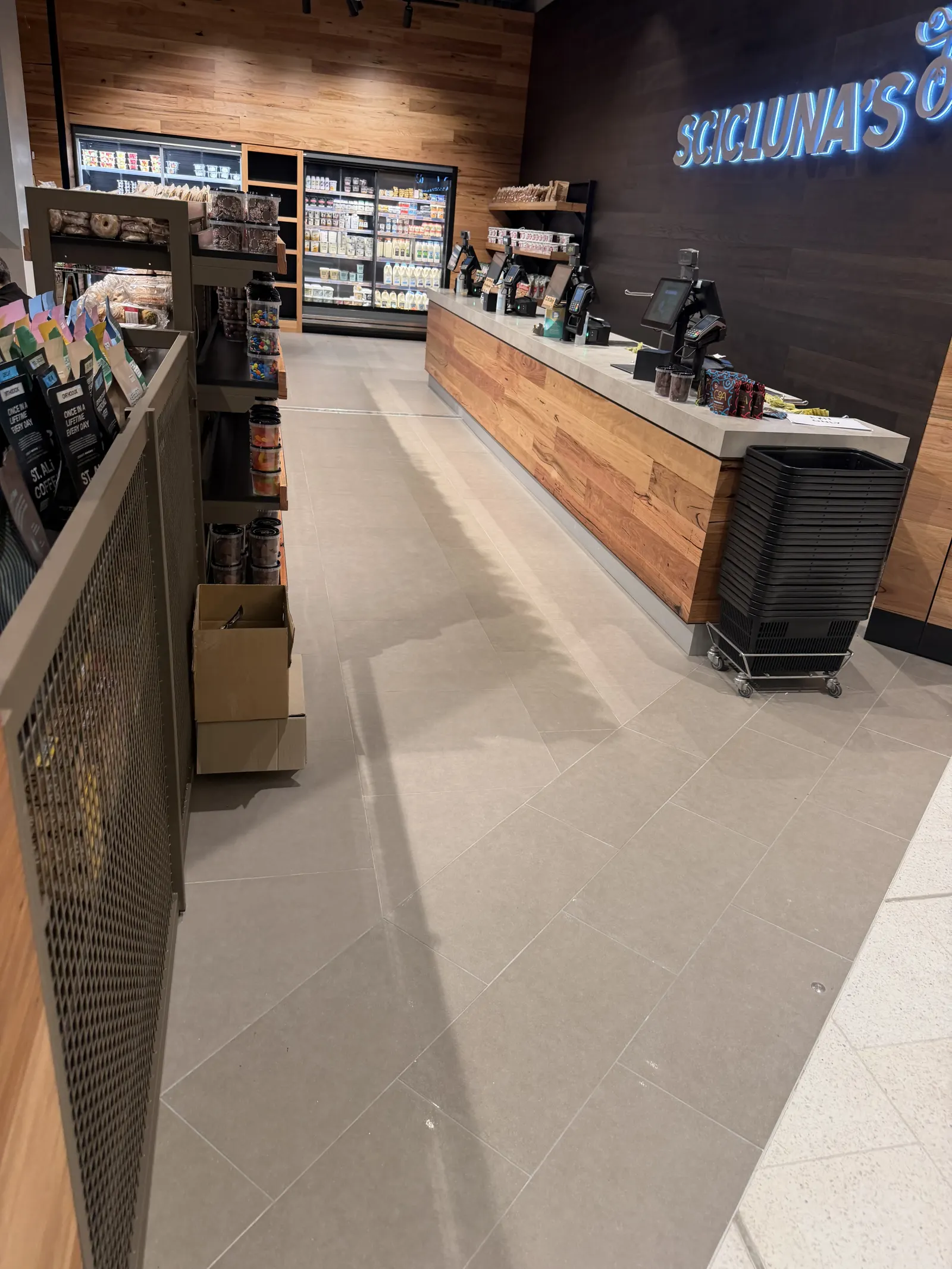 Finished porcelain floor through Scicluna's grocery aisle
