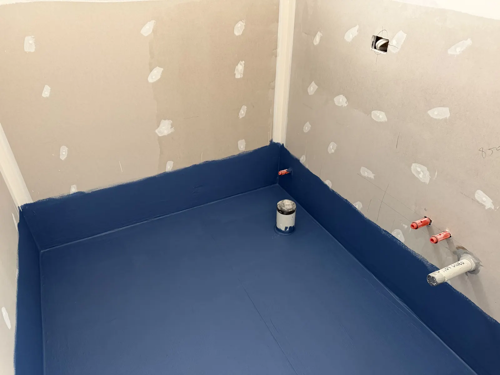 Waterproofing membrane applied over plasterboard substrate before tiling